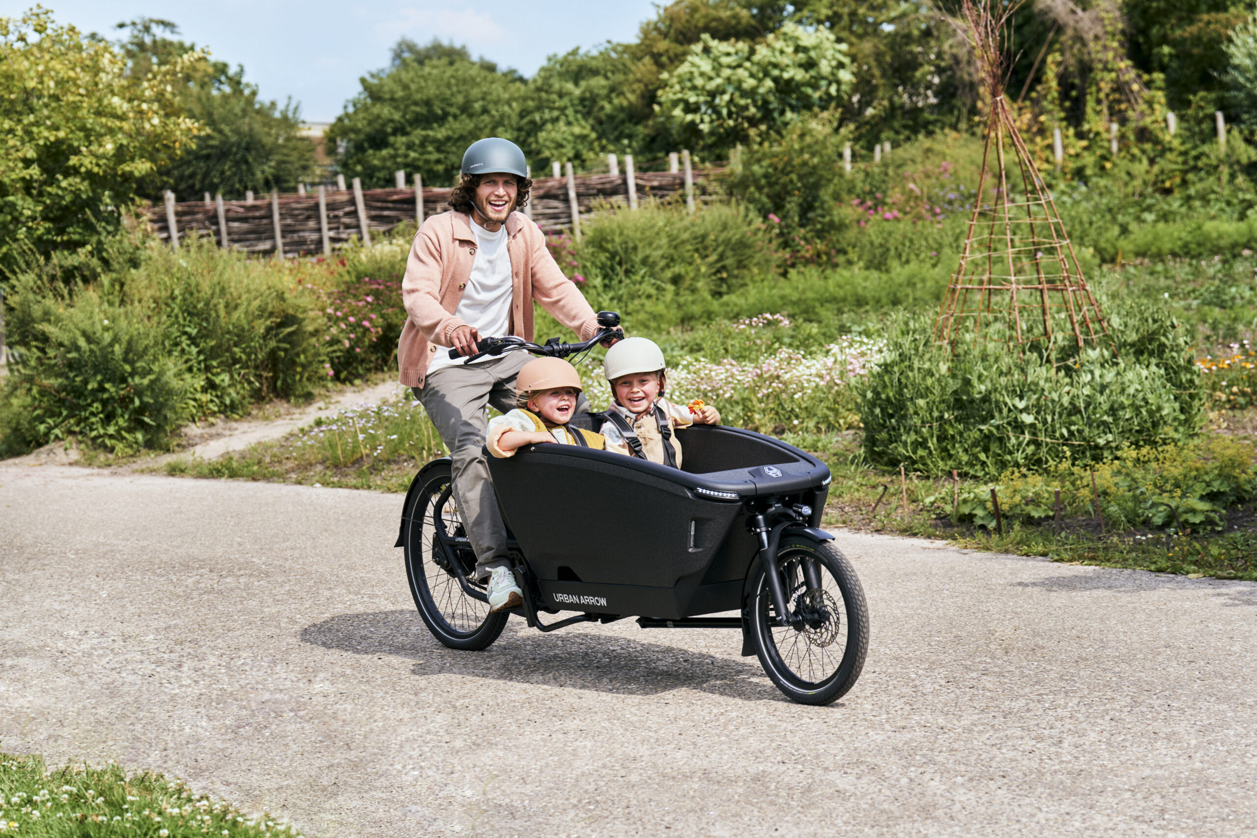 Urban Arrow cargo bike in action — family with children